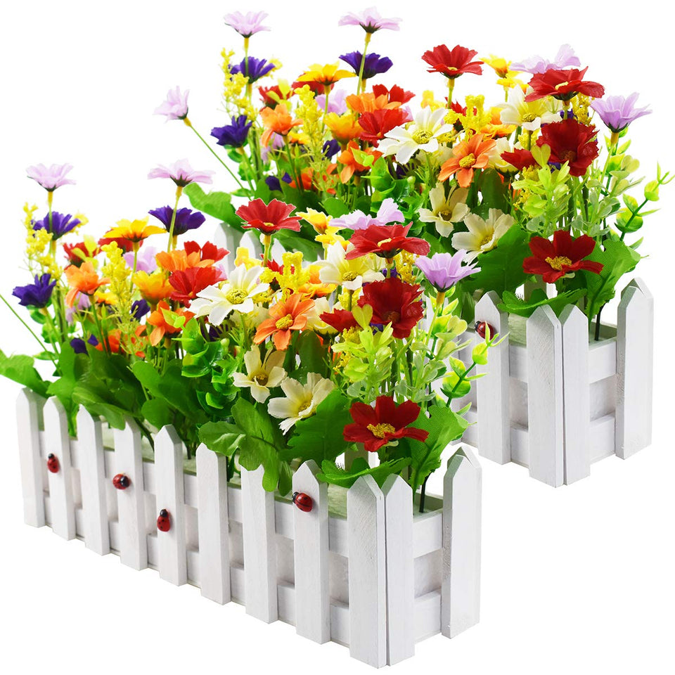 XONOR artificial daisies in picket fence pot brighten indoor spaces