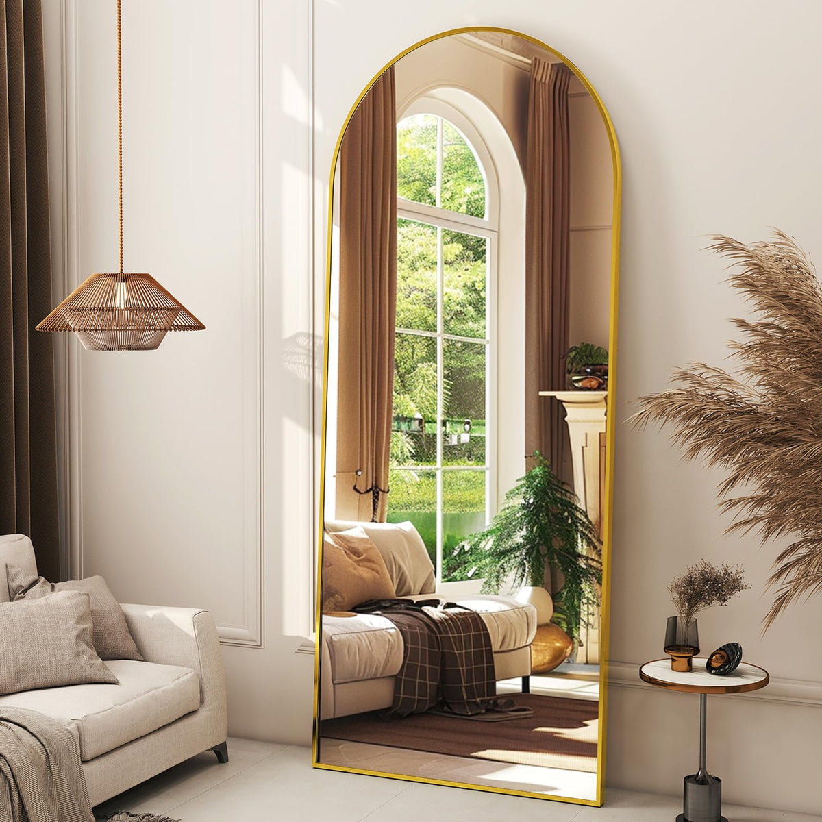 XRAMFY arched full-length mirror in gold frame reflects light for a spacious feel