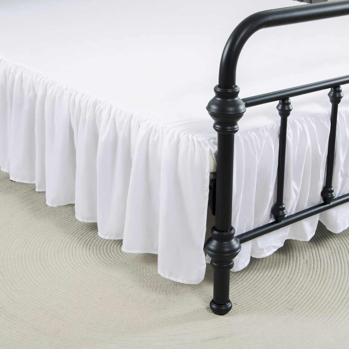 Xuan Dian queen bed skirt with white platform keeps the fabric in place for a clean look.