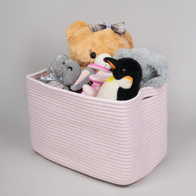 XUANGUO decorative storage basket complements shelf decor with light pink finish.