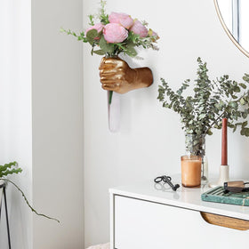 Stylish home accent for bedrooms, offices, or entryways with gold hand vase.