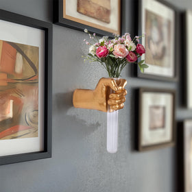 Decorative flower display in a wall-mounted glass tube provided by XYQXYQ.