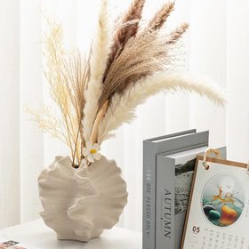 XYQXYQ Modern Art Ceramic Vase styled on a bookshelf for a personal touch