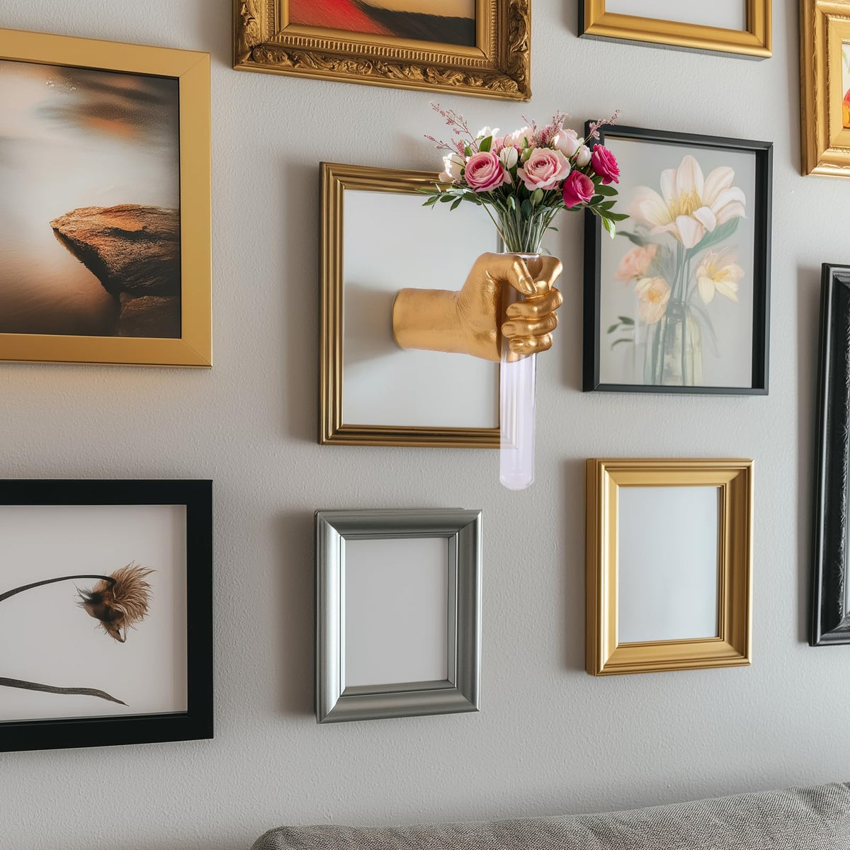 XYQXYQ gold hand sculpture complements living rooms with eclectic style.