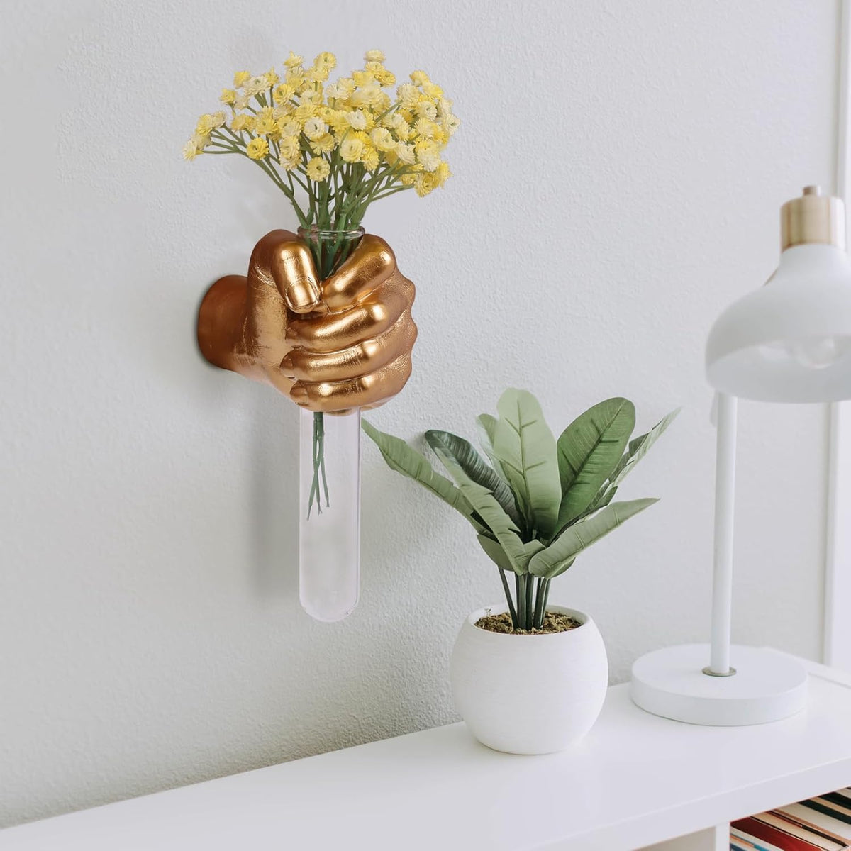 Glass test-tube vase sits securely in the wall-mounted sculpture for elegant displays.