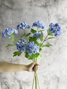 YalzoneMet wedding bouquet inspiration using lifelike hydrangea stems.