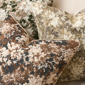 Yangest neutral pillow cover in living room scene complements warm coffee tones.