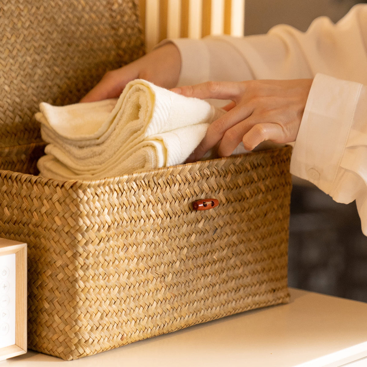 YANGQIHOME woven rectangular storage bins neatly organized on shelves.