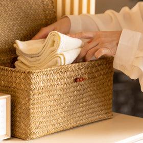 YANGQIHOME woven rectangular storage bins neatly organized on shelves.
