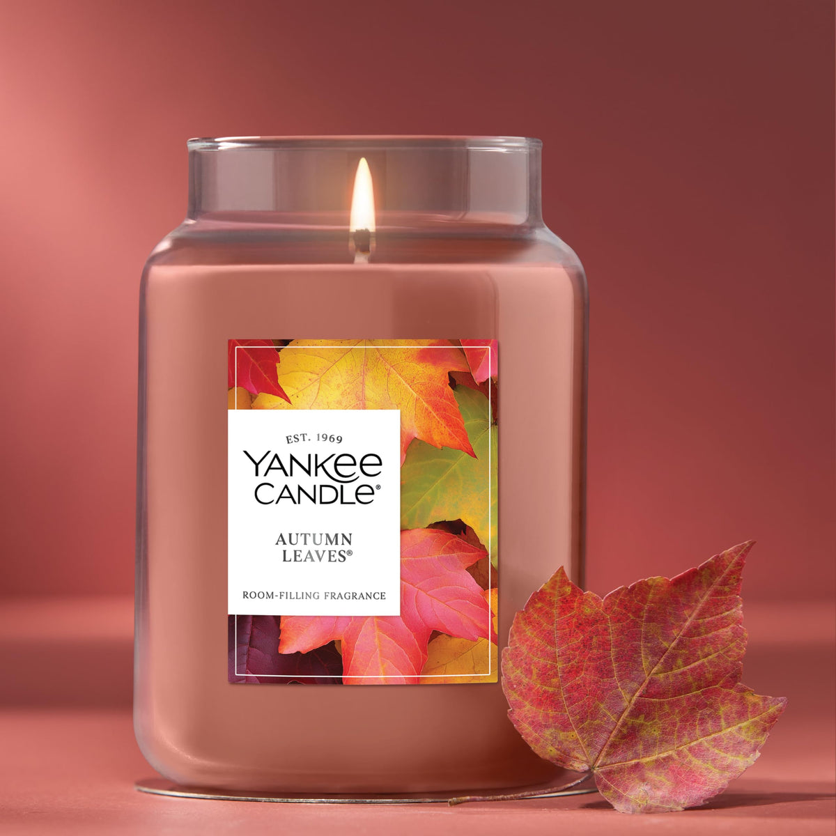 Yankee Candle Autumn Leaves natural-wick close-up, consistent burn with reduced soot.
