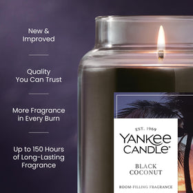 Yankee Candle Black Coconut candle burning with warm glow to fill the room.