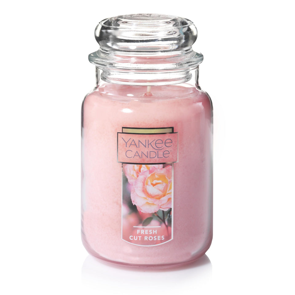 Yankee Candle Fresh Cut Roses 22oz jar enhances living room ambiance with romantic floral notes.