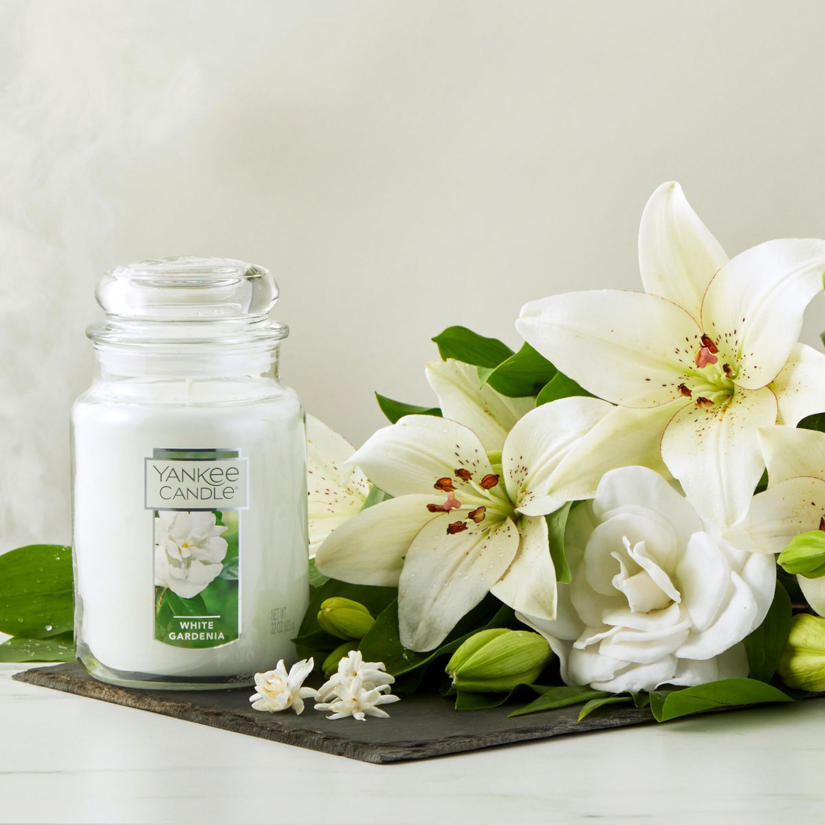 Gardenia blooms image from Yankee Candle highlights premium wax for a calm home.
