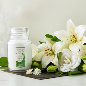Gardenia blooms image from Yankee Candle highlights premium wax for a calm home.