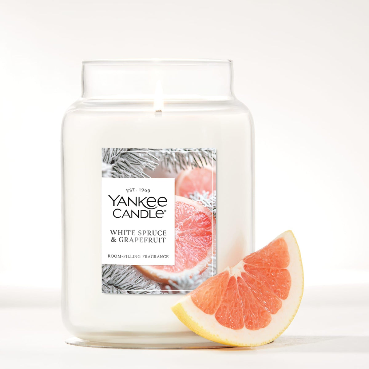 Yankee Candle natural-fiber wick close-up promoting even burn and fragrance throw.
