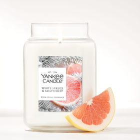 Yankee Candle natural-fiber wick close-up promoting even burn and fragrance throw.