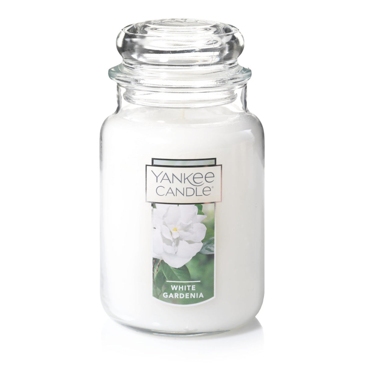 Yankee Candle White Gardenia jar with lush blooms enhances a welcoming room.