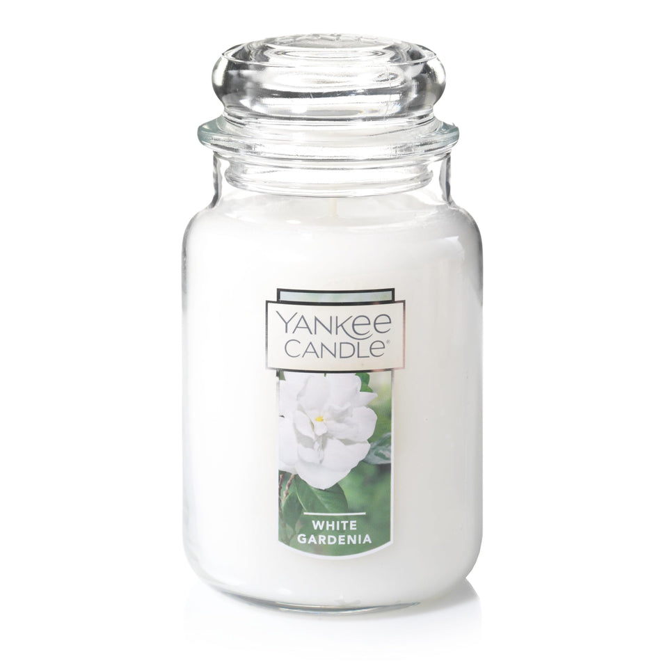 Yankee Candle White Gardenia jar with lush blooms enhances a welcoming room.