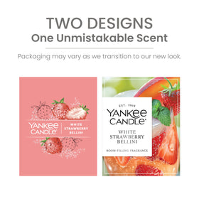 Yankee Candle White Strawberry Bellini pillar amber glow at dusk
