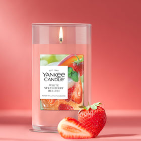 Yankee Candle White Strawberry Bellini pillar lit with warm glow