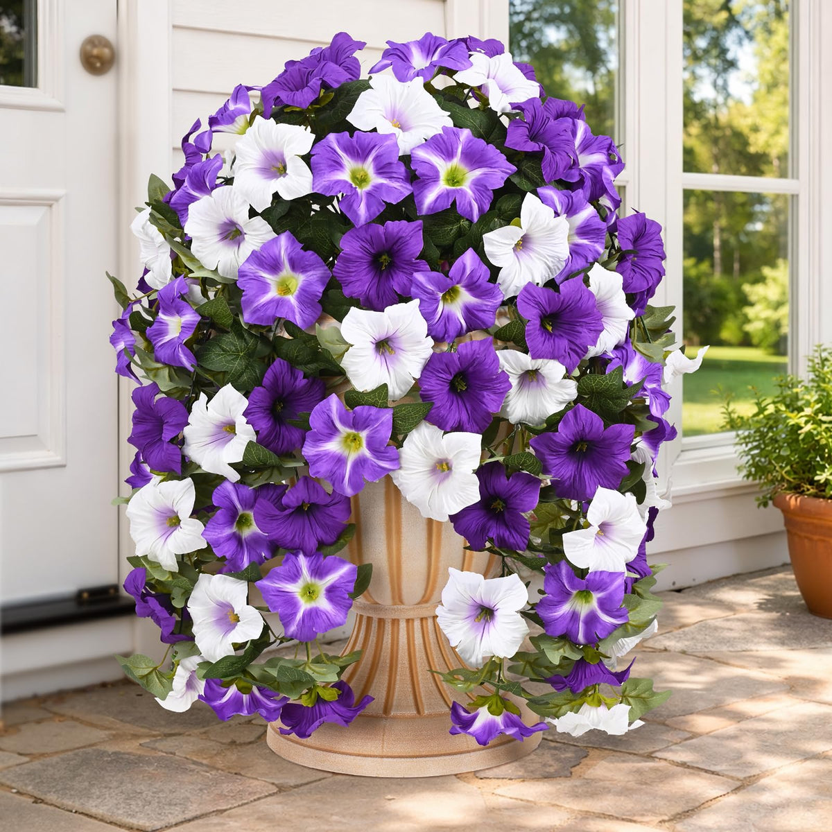 Yastouay petunias hanging outdoors in purple and white brighten a porch