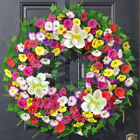Yastouay Spring Wreath with petunias and magnolia blooms brightens your front door.