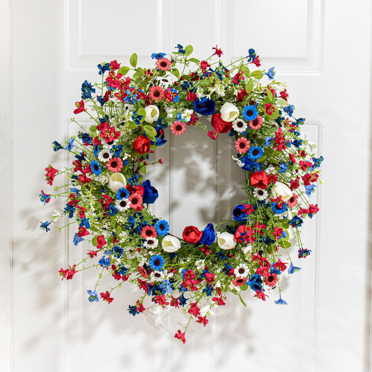 Yawwind 4th of July wreath with silk tulips adds vibrant flag colors to entryways.