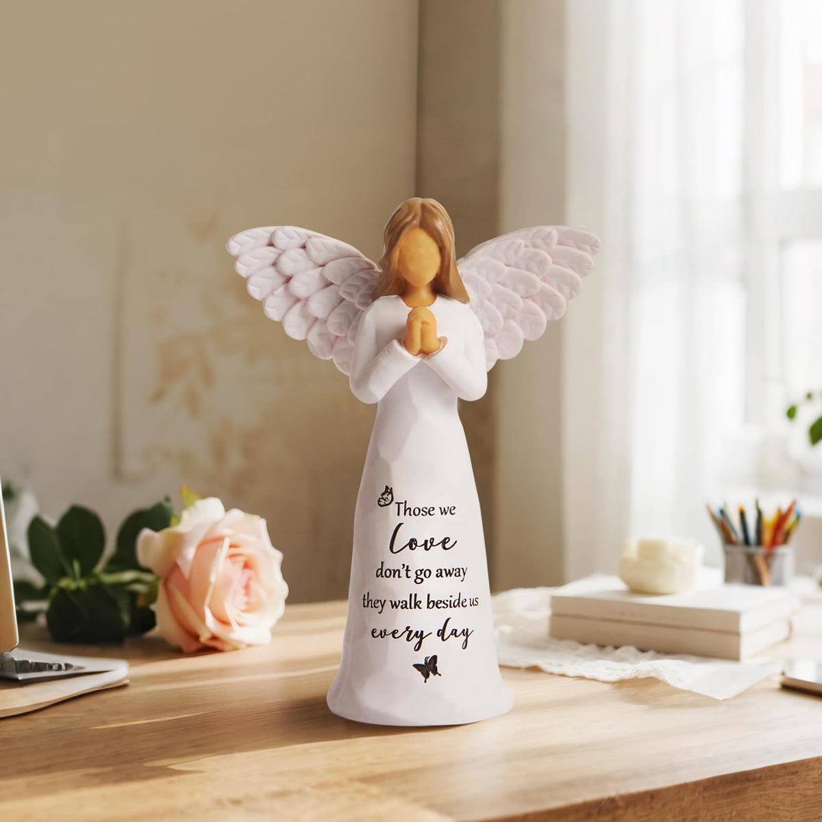 Yeegook angel figurine wings detail highlights delicate craftsmanship for display.