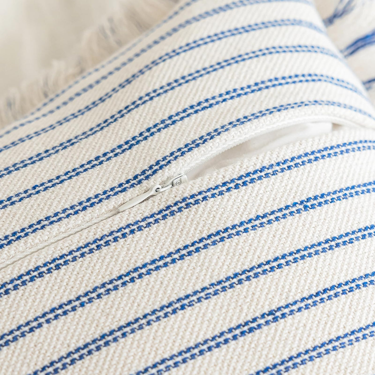 YEENAASY boho pillow cover styled on a blue sofa for relaxed ambiance