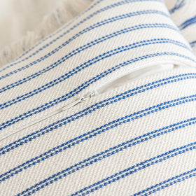 YEENAASY boho pillow cover styled on a blue sofa for relaxed ambiance