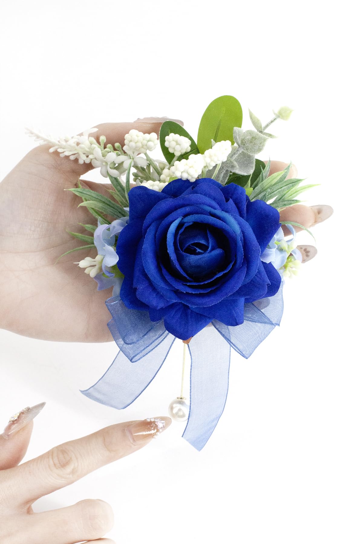 Yelinart boutonniere features a pearl brooch pin for secure elegance.