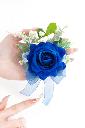 Yelinart boutonniere features a pearl brooch pin for secure elegance.
