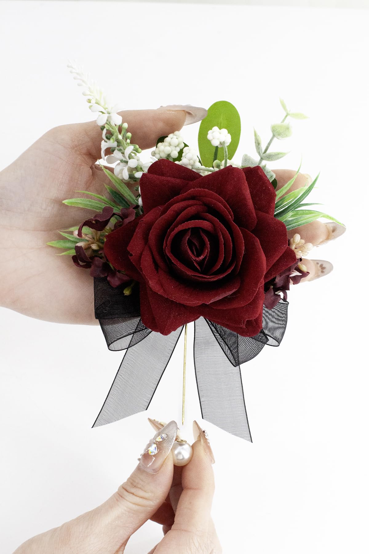 Yelinart burgundy boutonniere closeup highlighting pearl pin