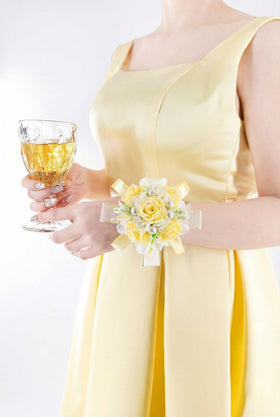 Yelinart craftsmanship with pearls and satin ribbons adds refined detail.