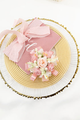 Yelinart rose corsage detailing with satin ribbons and pearls