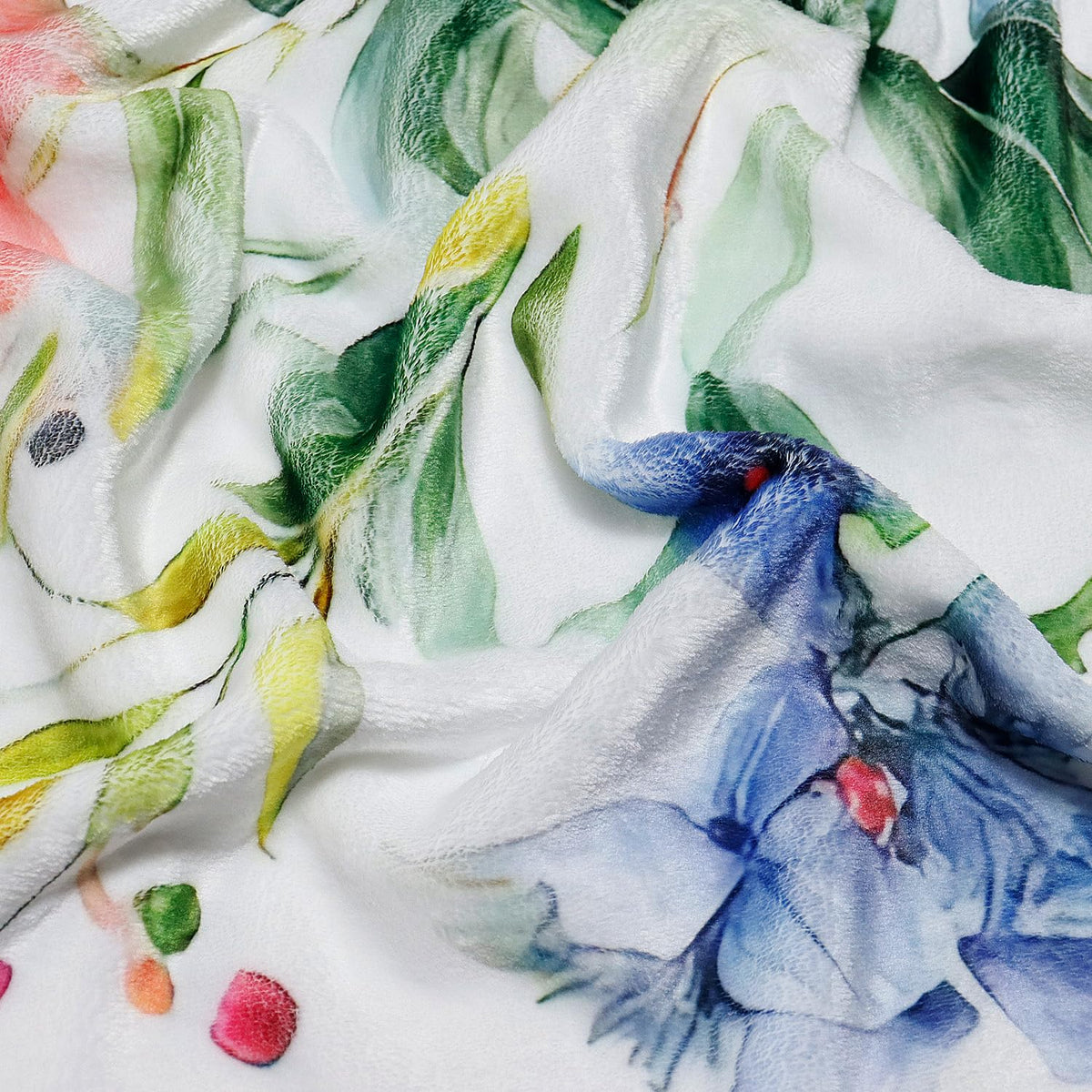 Yersion bed or couch blanket adds vibrant floral warmth.
