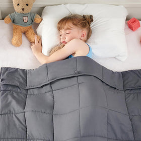 Yescool weighted blanket grey 36x48 draped on bed for cozy comfort