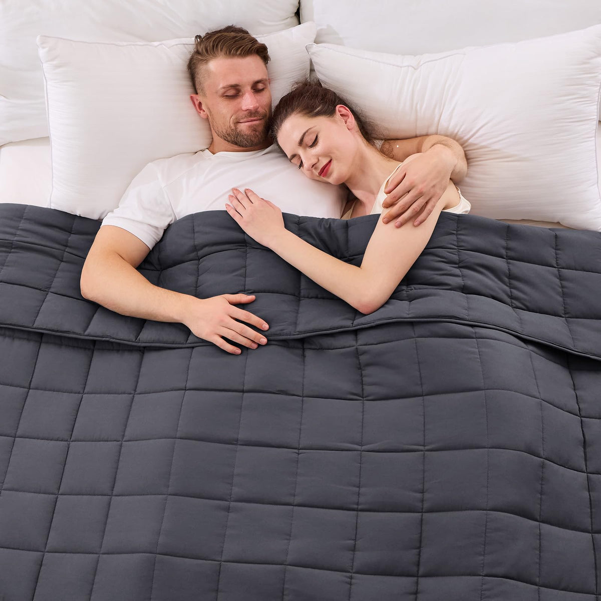 YesCool weighted blanket on a queen bed in grey promotes restful sleep.