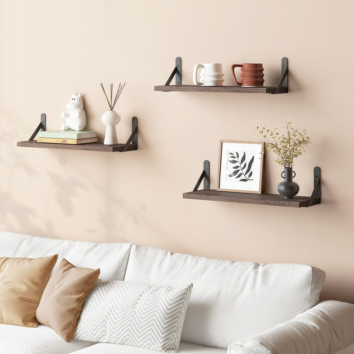 YGEOMER living room decor with framed photos and small plants.
