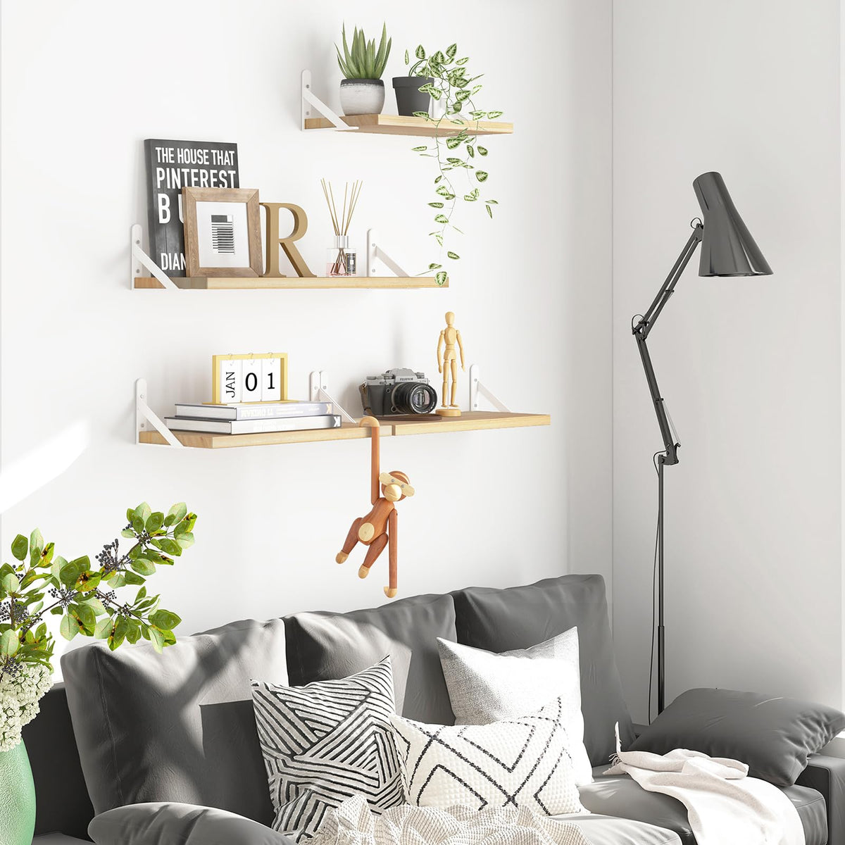 YGEOMER floating shelves in living room displaying plants, books, and decor