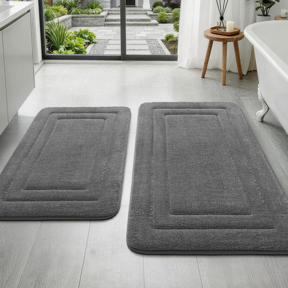 YIHOUSE 2-piece bath rug set with embossed border enhances bathroom coordination and style.