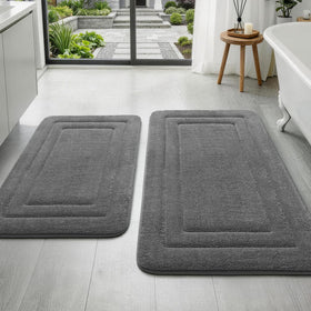 YIHOUSE 2-piece bath rug set with embossed border enhances bathroom coordination and style.