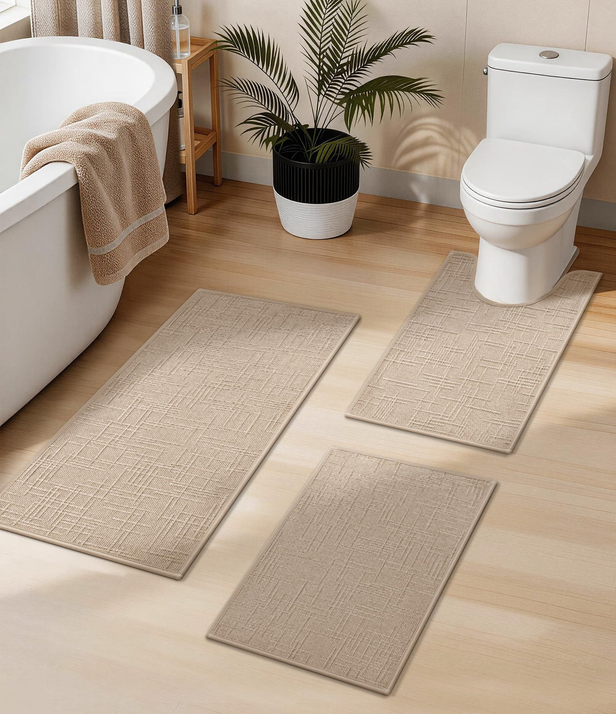 YIHOUSE 3-piece beige bathroom rug set on the floor for cohesive bath décor