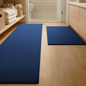 YIHOUSE 2-piece dark blue bath rugs with non-slip underfoot protection.