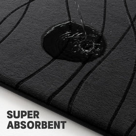 YIHOUSE memory foam bath mat 24x17 in black near the sink