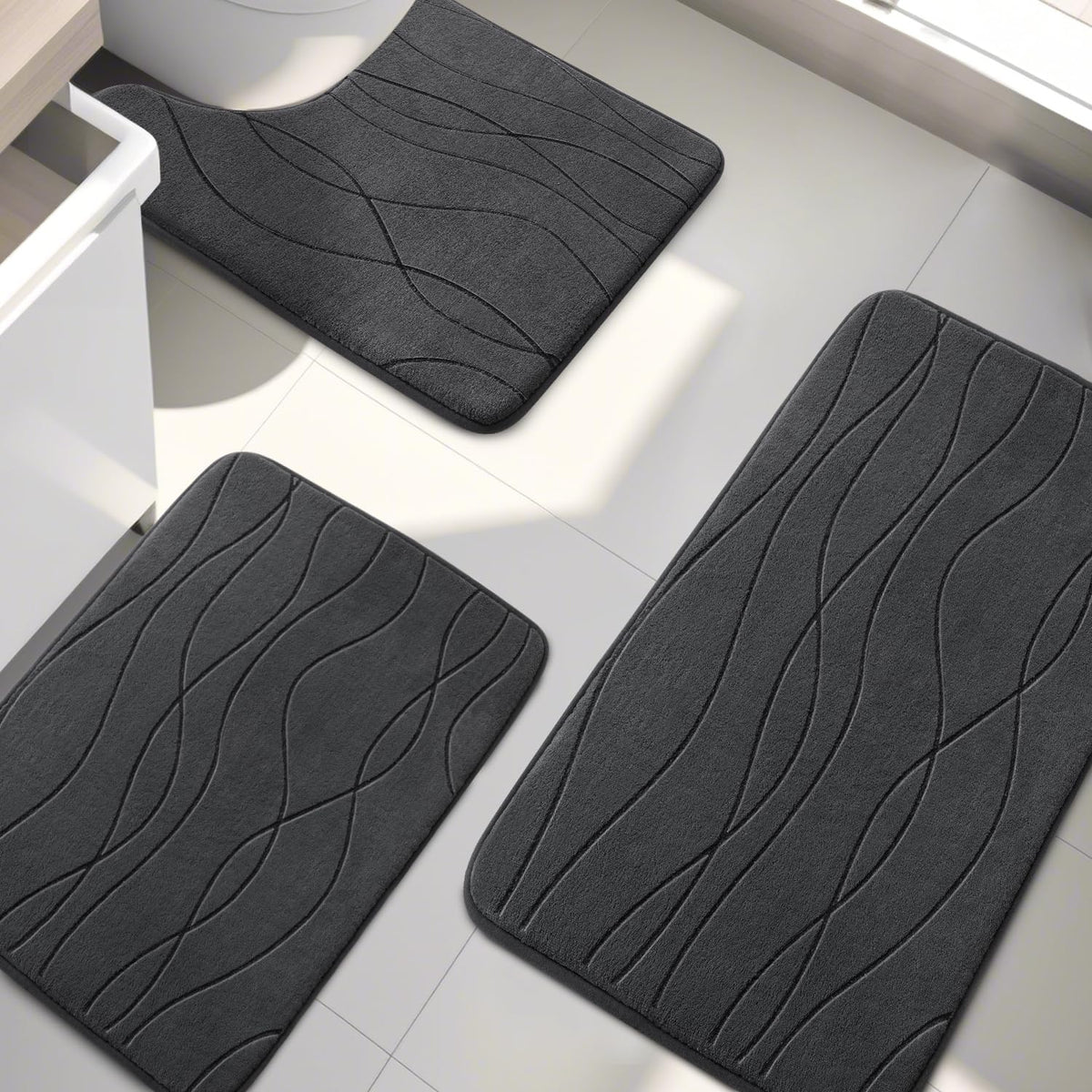 Dark grey YIHOUSE memory foam rug complements modern bathrooms and hides wear.