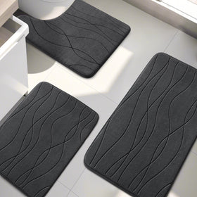 Dark grey YIHOUSE memory foam rug complements modern bathrooms and hides wear.