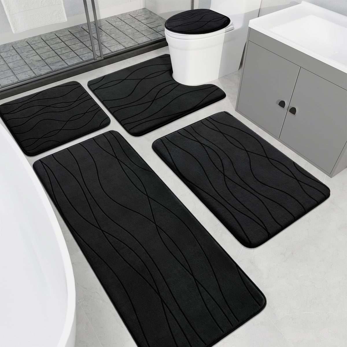 YIHOUSE memory foam black rug set, plush underfoot in a modern bathroom.