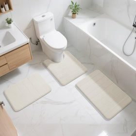 Yimobra memory foam bath mat in a large bathroom with two sinks.
