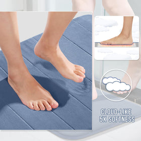 Non-slip backing on denim rug provides stable footing on wet bathroom floors.